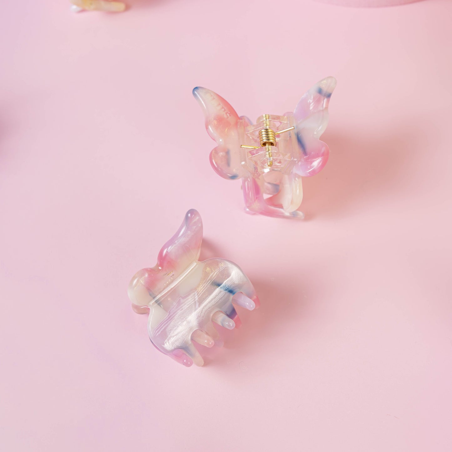 Mini vlinder clip fijn haar roze blauw